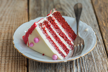 Image showing Piece of cake Red velvet on a plate closeup.