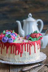 Image showing Cake with flowers of cream for coffee.