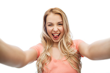 Image showing happy smiling young woman taking selfie