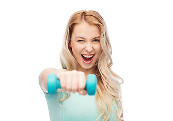 Image showing smiling beautiful young sporty woman with dumbbell