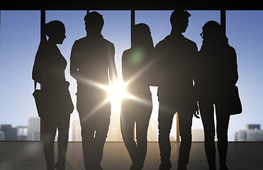 Image showing people silhouettes over office background