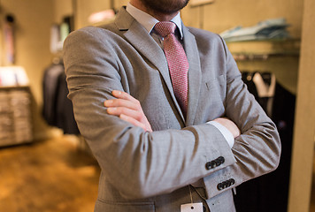 Image showing close up of man in suit and tie at clothing store