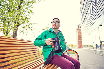 Image showing young hipster man with digital camera in city