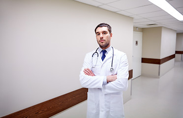 Image showing doctor with stethoscope at hospital corridor