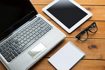 Image showing close up of on laptop, tablet pc and notebook