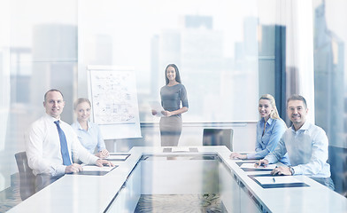 Image showing group of smiling businesspeople meeting in office