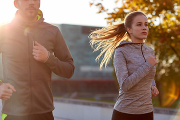 Image showing couple running outdoors