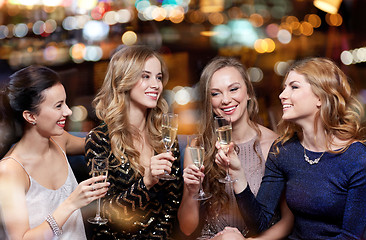 Image showing happy women with champagne glasses at night club