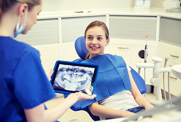 Image showing dentist with x-ray on tablet pc and patient girl