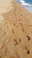 Image showing Footsteps on the beach by the sea