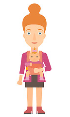 Image showing Woman holding baby in sling.