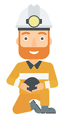 Image showing Miner holding coal in hands.