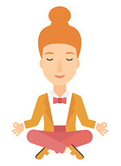 Image showing Business woman meditating in lotus pose.