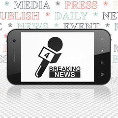 Image showing News concept: Smartphone with Breaking News And Microphone on display