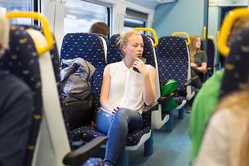 Image showing Woman travelling by train.