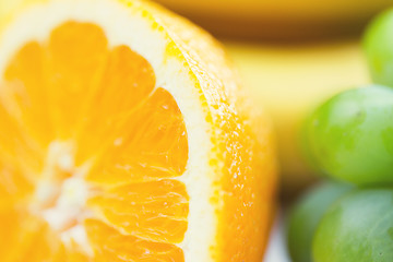 Image showing close up of fresh juicy orange and grape