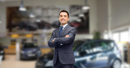 Image showing businessman or car dealer over auto show