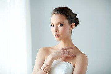 Image showing beautiful asian woman with ring and bracelet