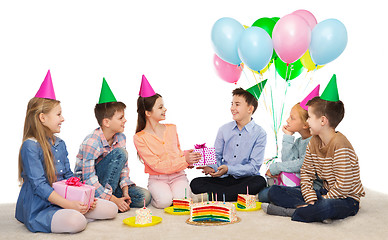 Image showing happy children giving presents at birthday party