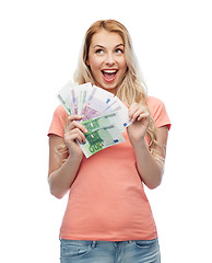 Image showing happy young woman with euro cash money