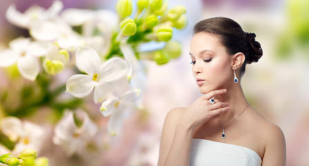 Image showing beautiful woman with earring, ring and pendant