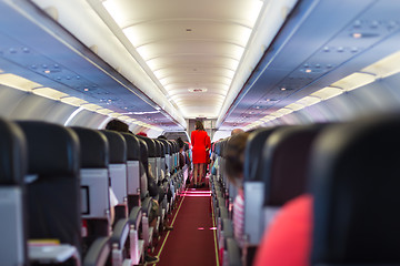 Image showing Stewardess on the airplane.