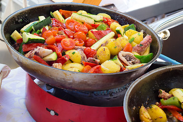 Image showing Cheff cooking on outdoor street food festival.