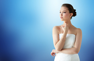 Image showing beautiful asian woman with golden bracelet