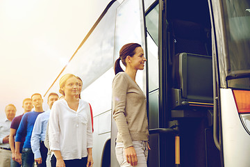 Image showing group of happy passengers boarding travel bus