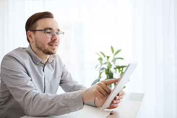 Image showing happy creative male office worker with tablet pc