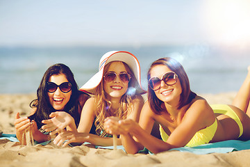 Image showing girls sunbathing on the beach