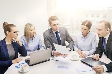 Image showing business team with laptop having discussion