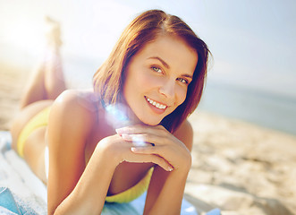 Image showing girl sunbathing on the beach