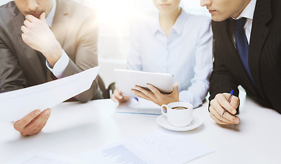 Image showing business team with graph, tablet pc and coffee