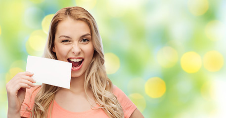 Image showing happy woman or teen girl with blank white paper