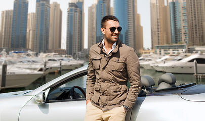 Image showing happy man near cabriolet car on city 