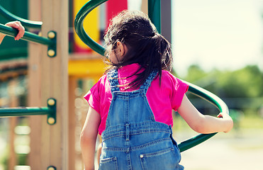 Image showing close up of girl climbing on children playground