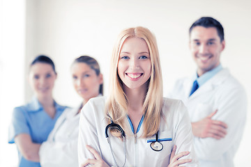 Image showing female doctor in front of medical group