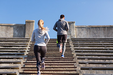 Image showing couple running upstairs on stadium