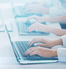 Image showing group of people working with laptops in office