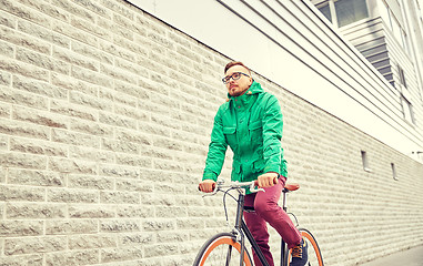 Image showing young hipster man riding fixed gear bike