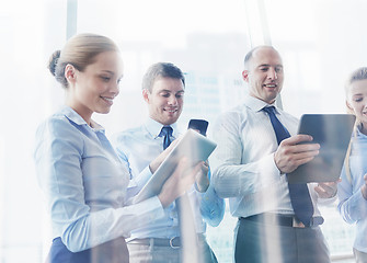 Image showing business people with tablet pc and smartphones