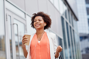 Image showing happy african businesswoman with coffee in city