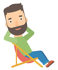 Image showing Man sitting in a folding chair.