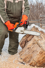 Image showing Carpenter working at sawmill 