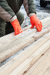 Image showing Carpenter working at sawmill 