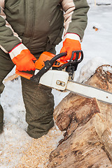 Image showing Carpenter working at sawmill 