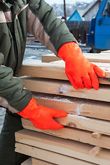 Image showing Carpenter working at sawmill 