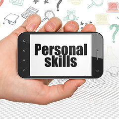 Image showing Education concept: Hand Holding Smartphone with Personal Skills on display