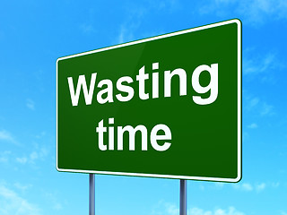 Image showing Timeline concept: Wasting Time on road sign background